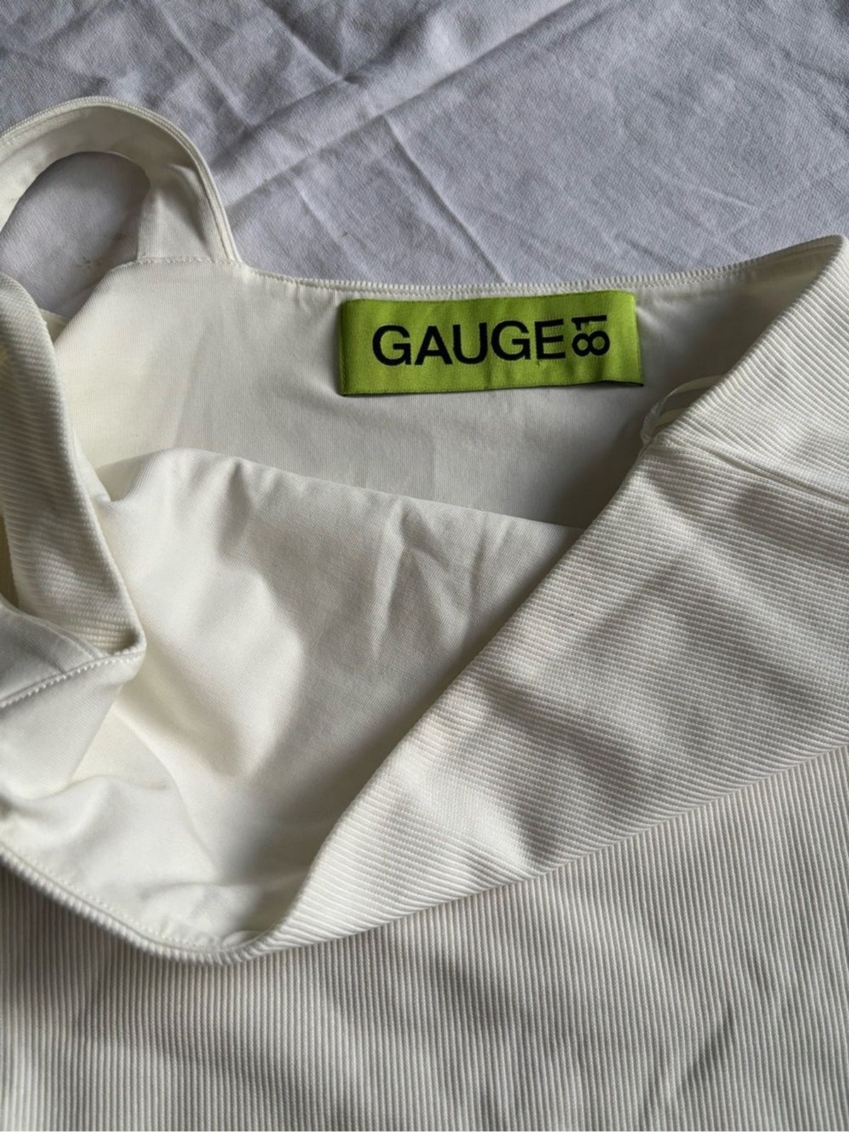 Gauge81 Cream One-Piece Asymmetrical Strap Bodysuit