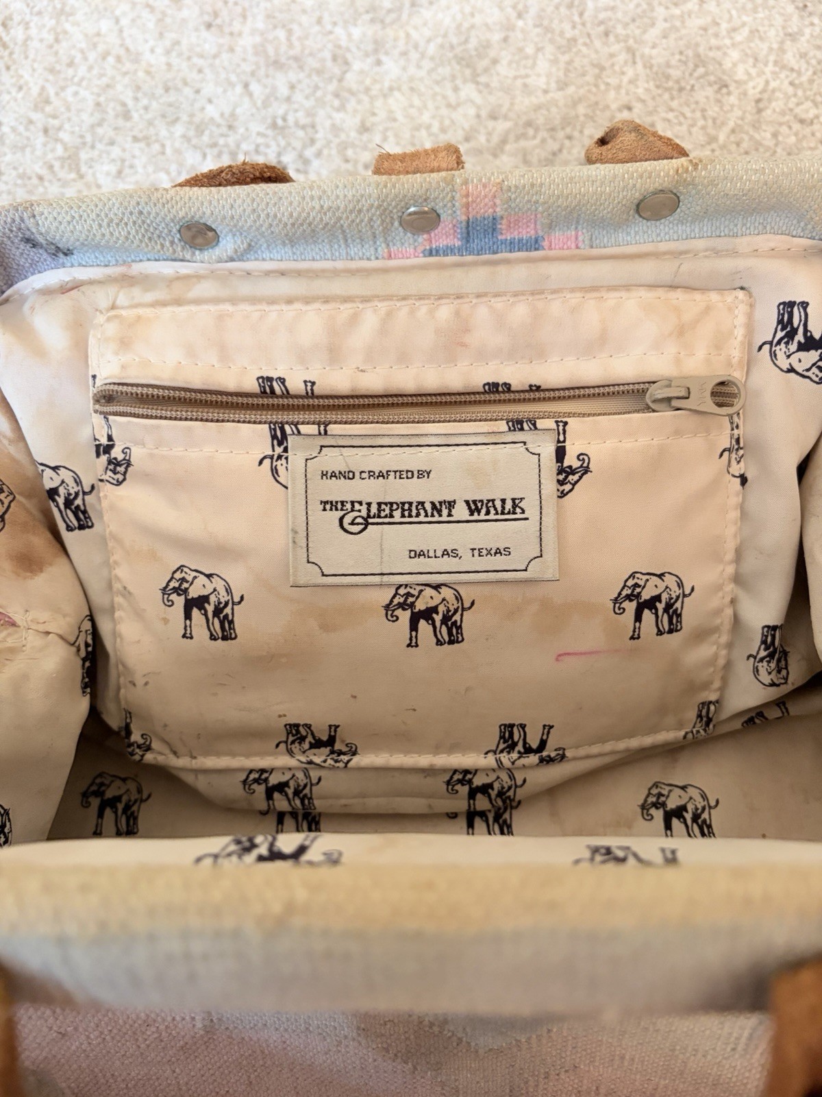 Vintage The Elephant Walk handbag with leather straps and metal elephant clasp