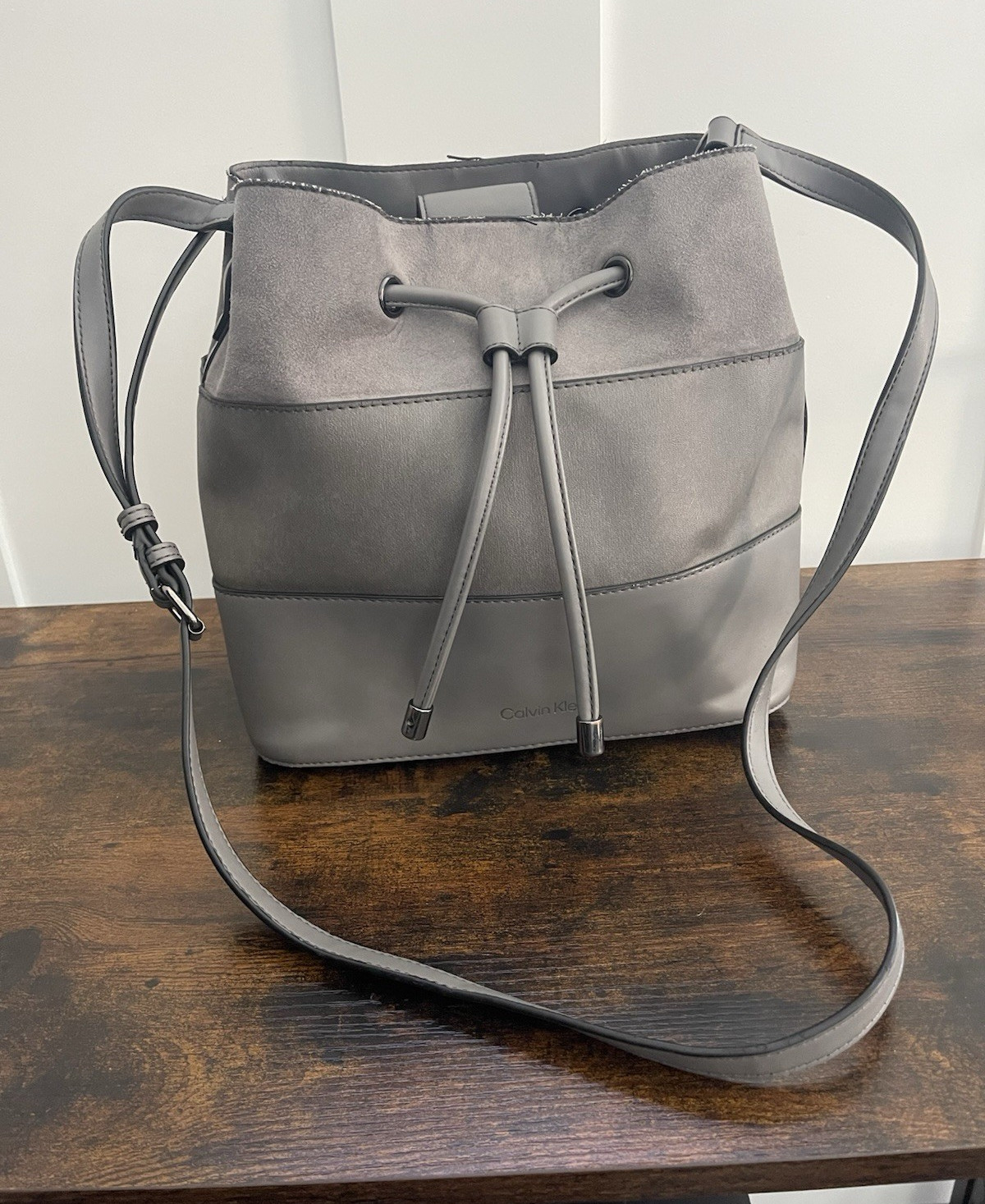 Calvin Klein Gray Drawstring Bucket Crossbody Bag Adjustable Strap Silver Logo