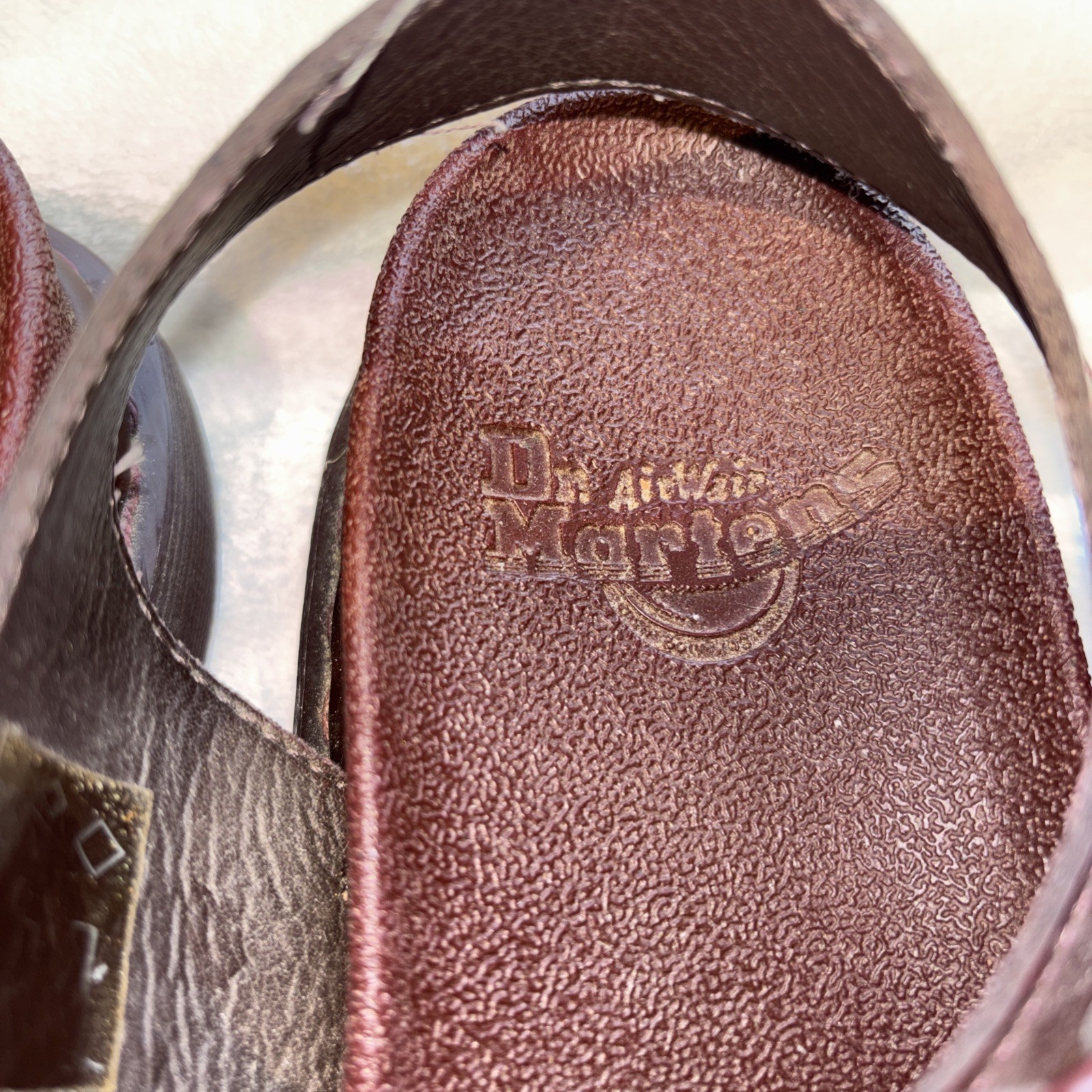 Dr. Martens Romi Y-Strap Sandals in an oxblood/brown patent leather finish
