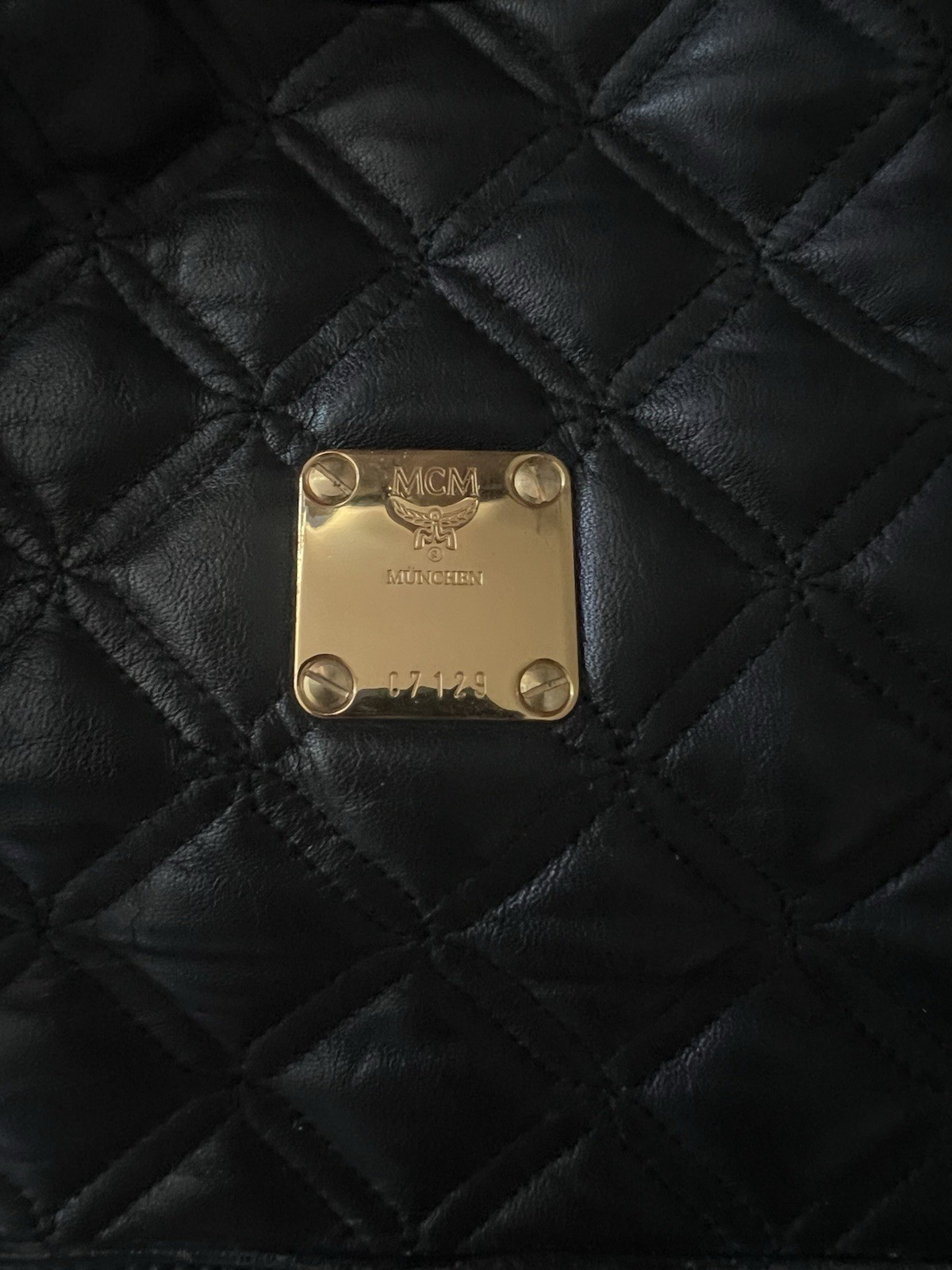 MCM Black Quilted Drawstring Bucket Shoulder Bag Tassel Logo Gold Hardware