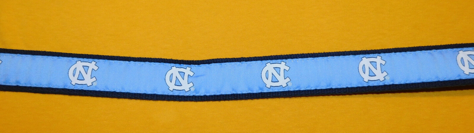 MEN’S NORTH CAROLINA U. COTTON WITH LEATHER TABS NC MOTIF BELT SIZE 32/80cm.