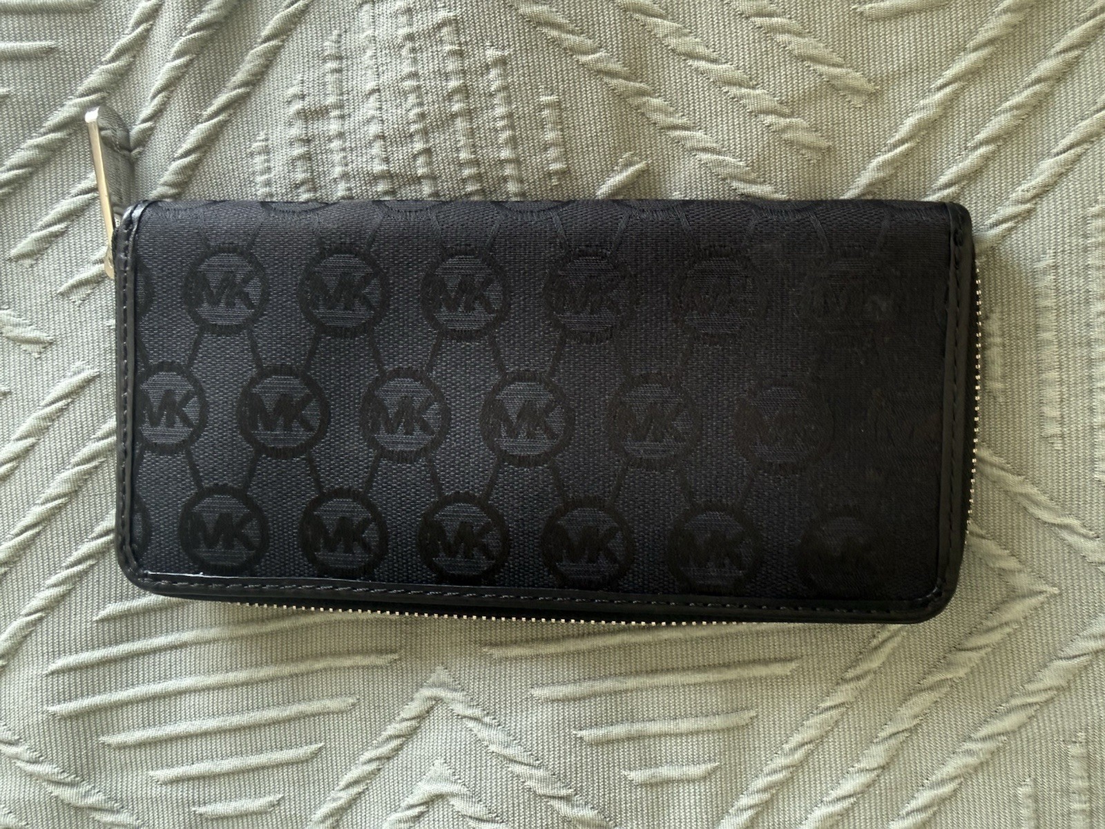 Michael Kors black zip around wallet with gold “Michael Kors Est 1981” Logo