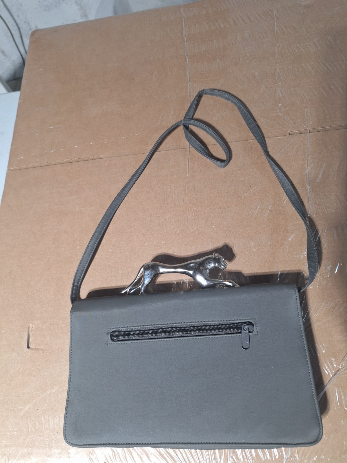 Grey jaguar crossbody handbag 12 inches width 7 inches length 5 1/2 inches deep