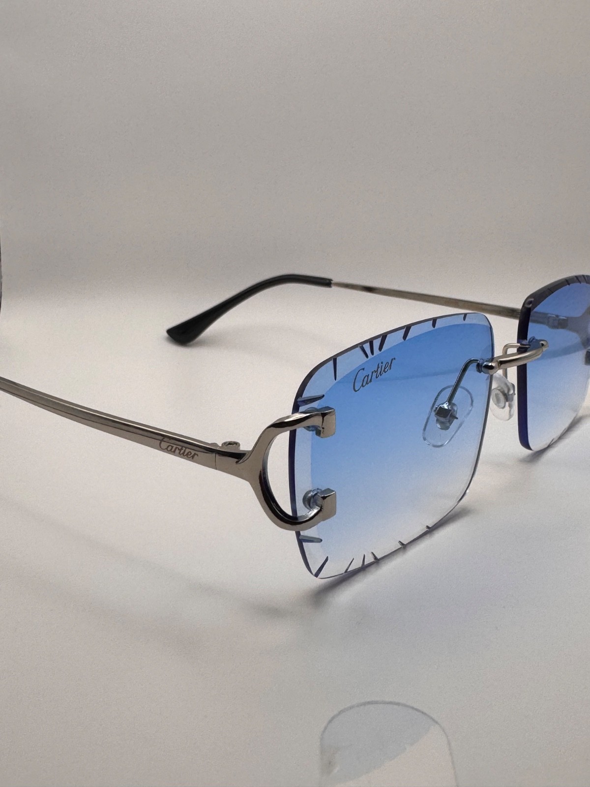 Cartier Big C Diamond Cut Frameless Blue Lens Silver Frame