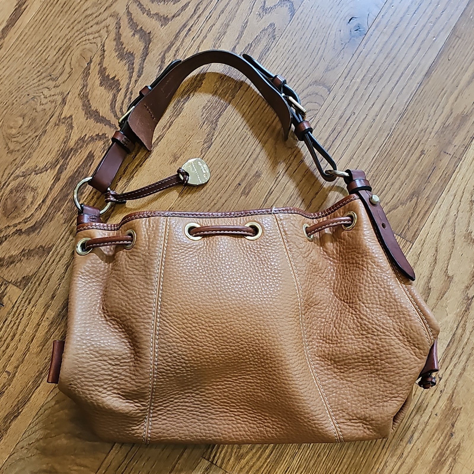 Dooney & Bourke Tan Pebbled Leather Drawstring Bucket Bag Tassel Shoulder Purse