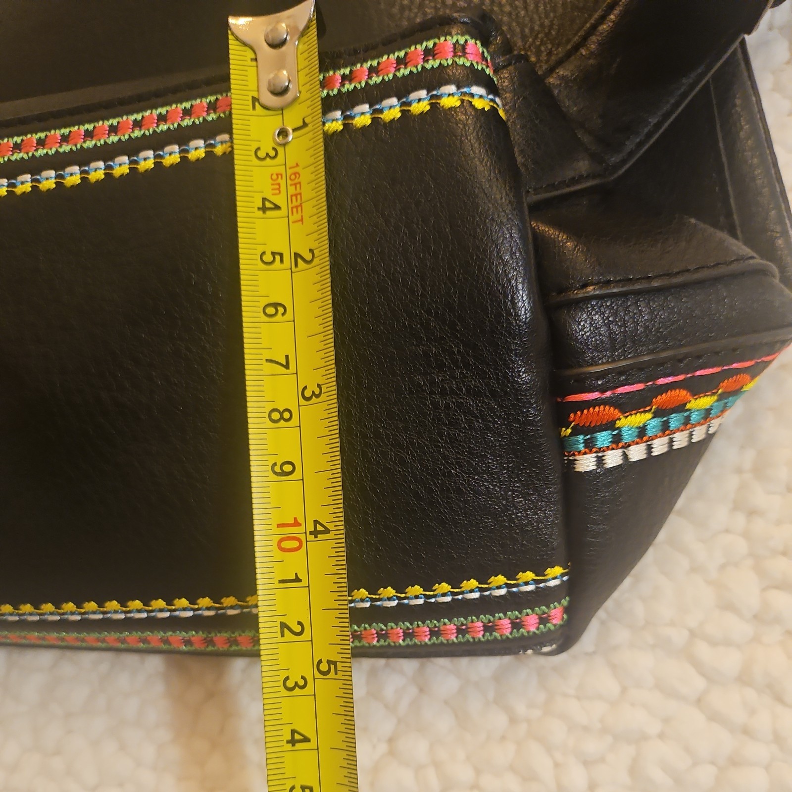 Midsize backpack,multicoloured embroidery,magnetic flap closure, zip, pockets.