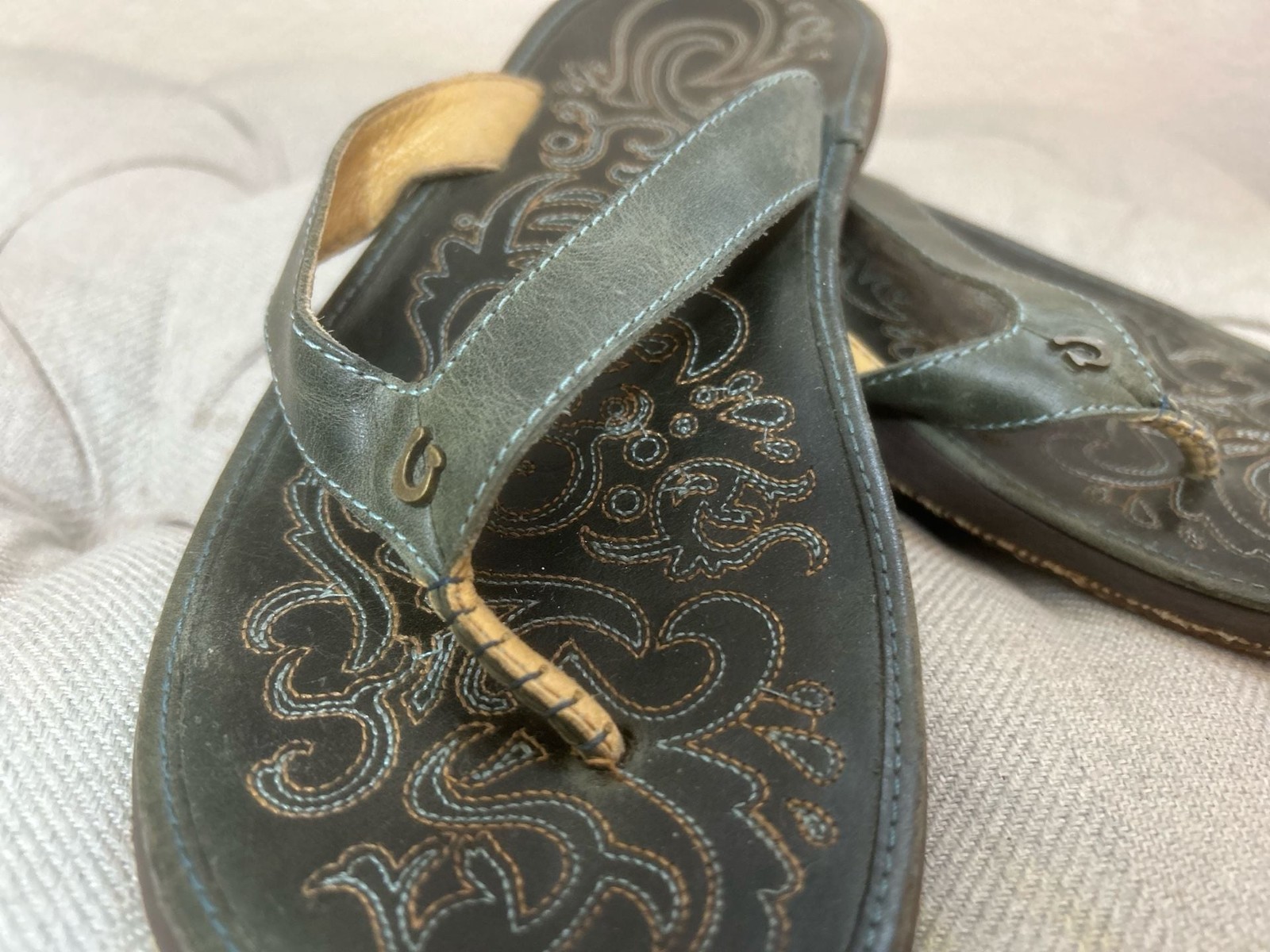 OluKai Paniolo Women’s Leather Flip Flops with Floral Stitching