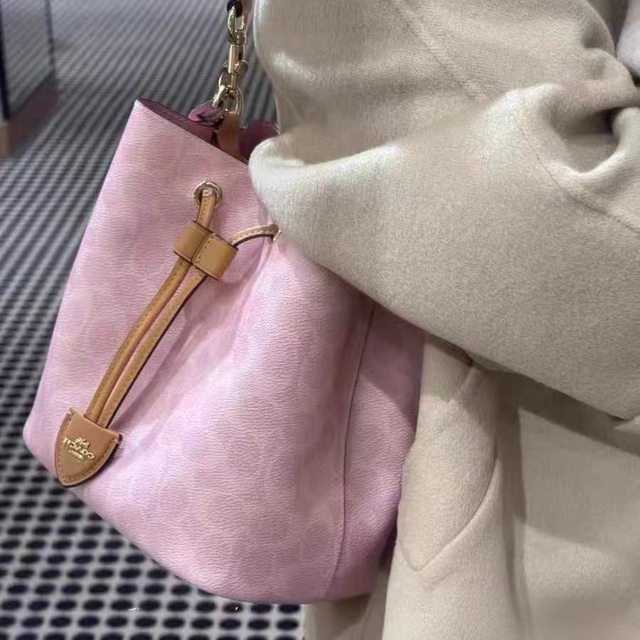 Coach CEA23 Rowan Bucket Bag In Signature Canvas With Charms Powder Pink