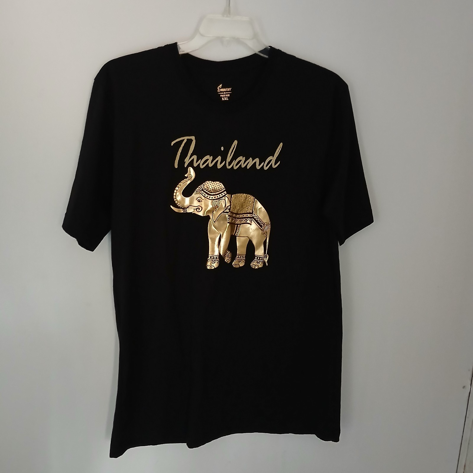Thailand souvenir shirt featuring a detailed gold-colored elephant