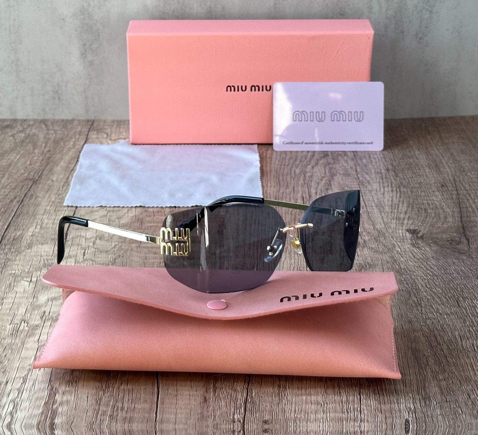 MIU MIU SUNGLASSES BLACK GRAY 100% AUTHENTIC WITH ORIGINAL PACKAGE SHIELD
