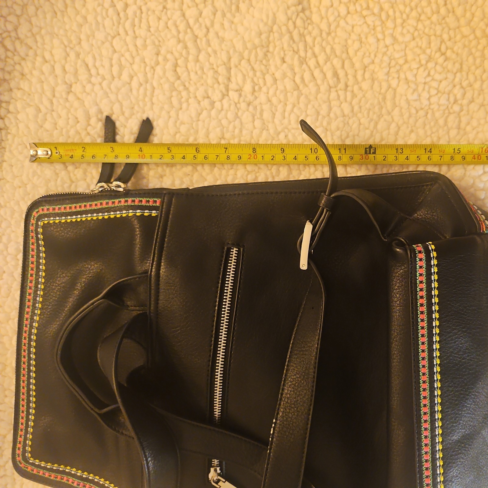 Midsize backpack,multicoloured embroidery,magnetic flap closure, zip, pockets.