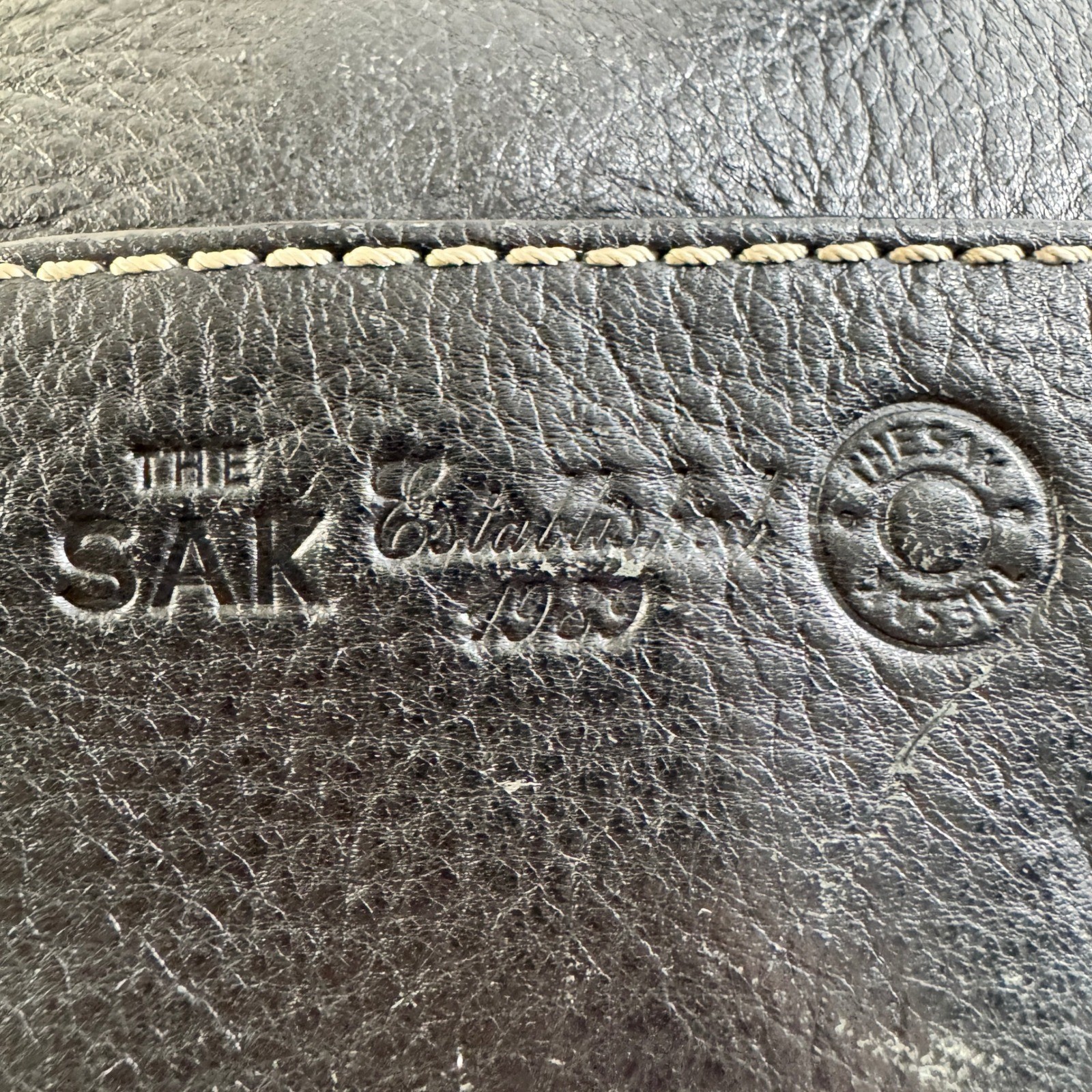 The Sak Black Leather Tote Bag With White Stitching And Tassel Accent Timeless