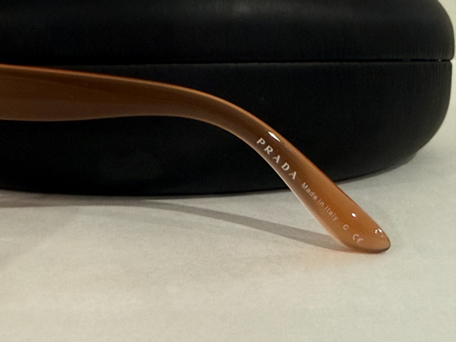 Prada Sunglasses SPR 04O semi-traslucent frame oversized rounded rims