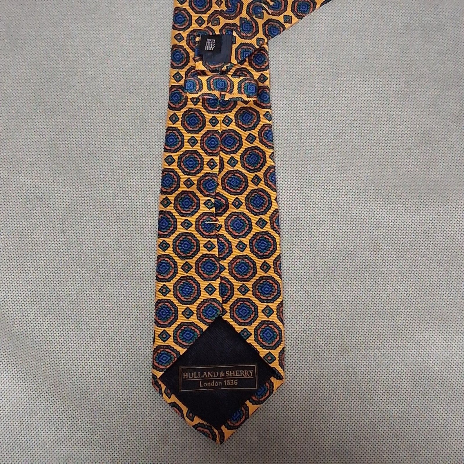 Holland & Sherry Silk Necktie Orange Blue Geometric 62″ x 3 1/8″ Made In USA