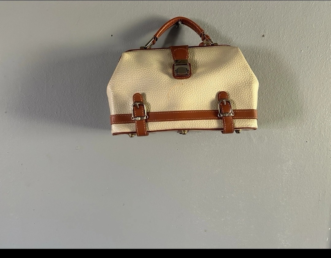 Dooney And Bourke Vintage all weather leather purse. 11 inches across and 7 t