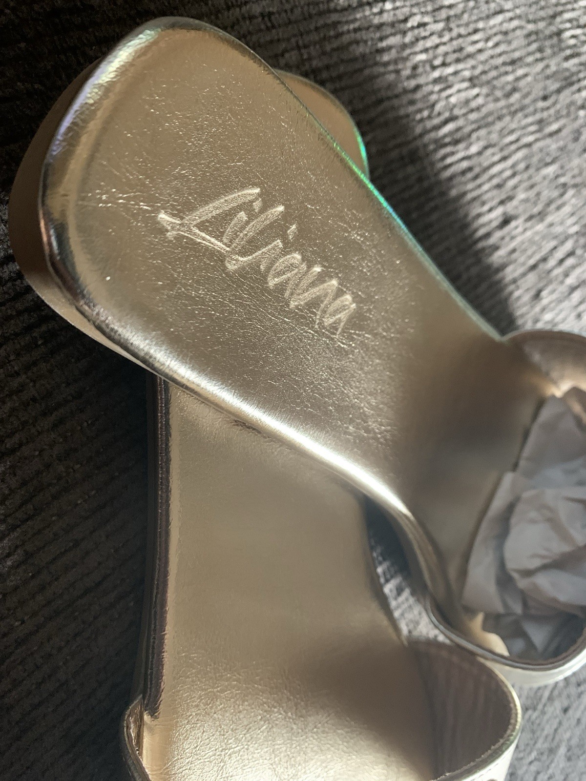 Liliana Rhinestone logo slide in gold.