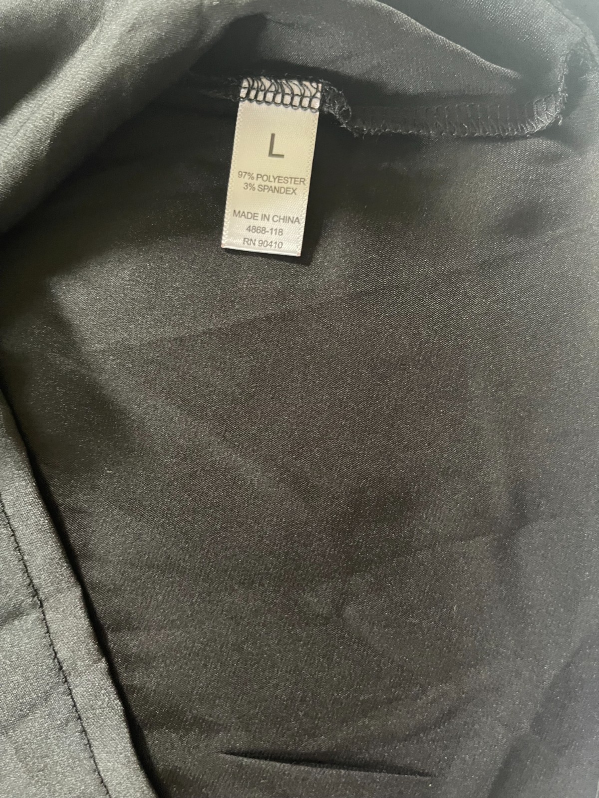 Nicole Miller. Elevate your style with this elegant size L blouse. Black color.