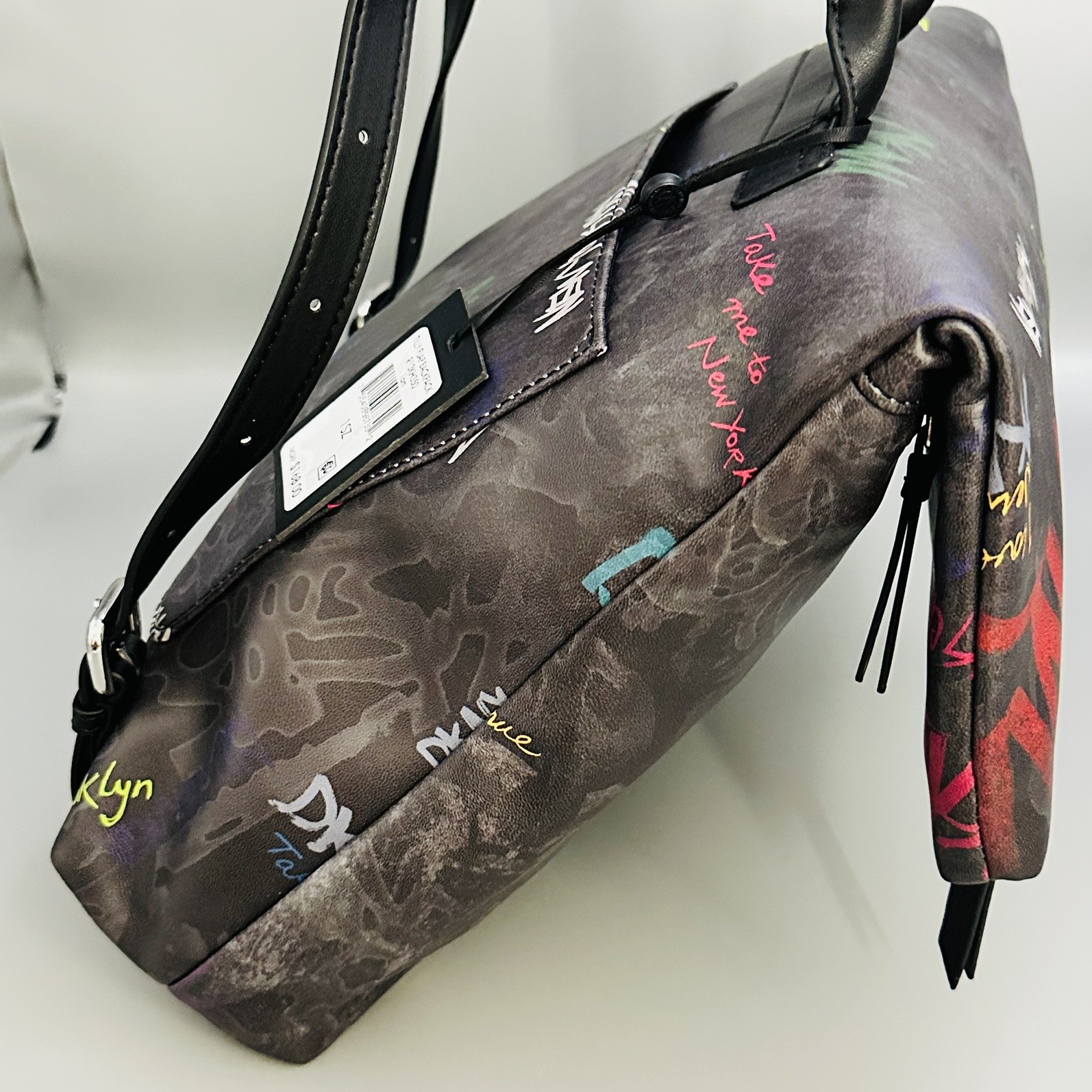 DKNY: Graffiti Tilly Flap Backpack, NWT W. Adjustable Straps