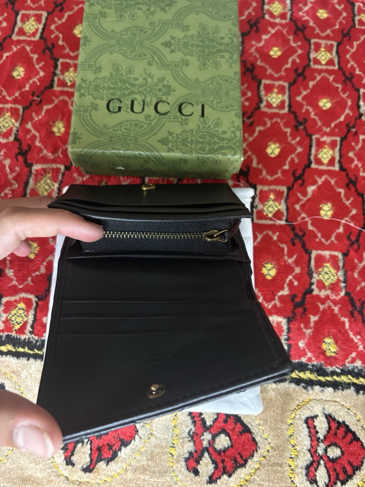 Gucci GG Marmont card case wallet in black quilted chevron leather.