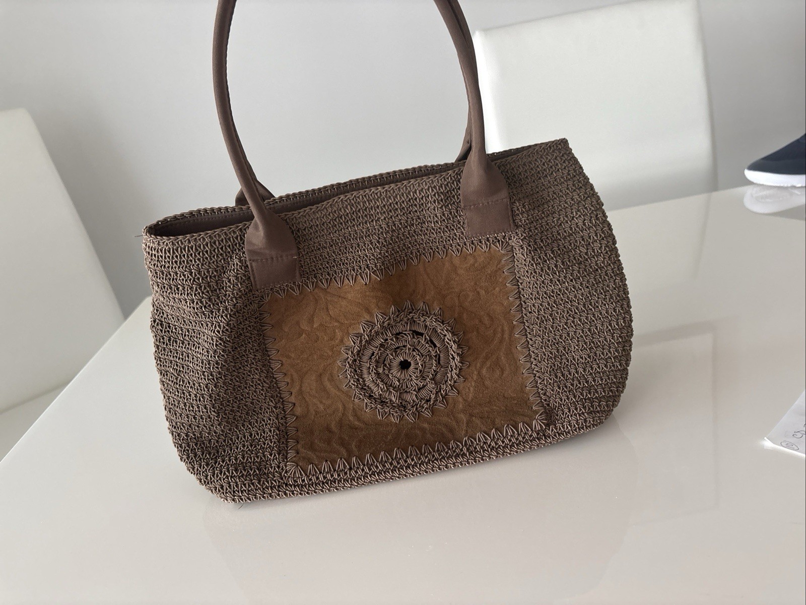 Tightly Woven bag Brown .68% Cotton/32 % olefin with man made material trim.