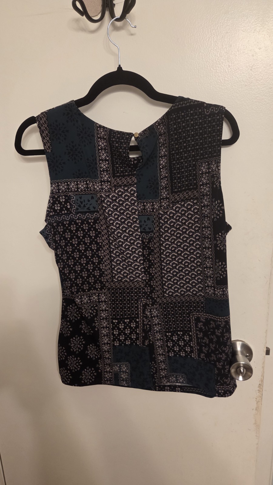 Calvin Klein sleeveless, featuring a black and navy patchwork bandana print. L