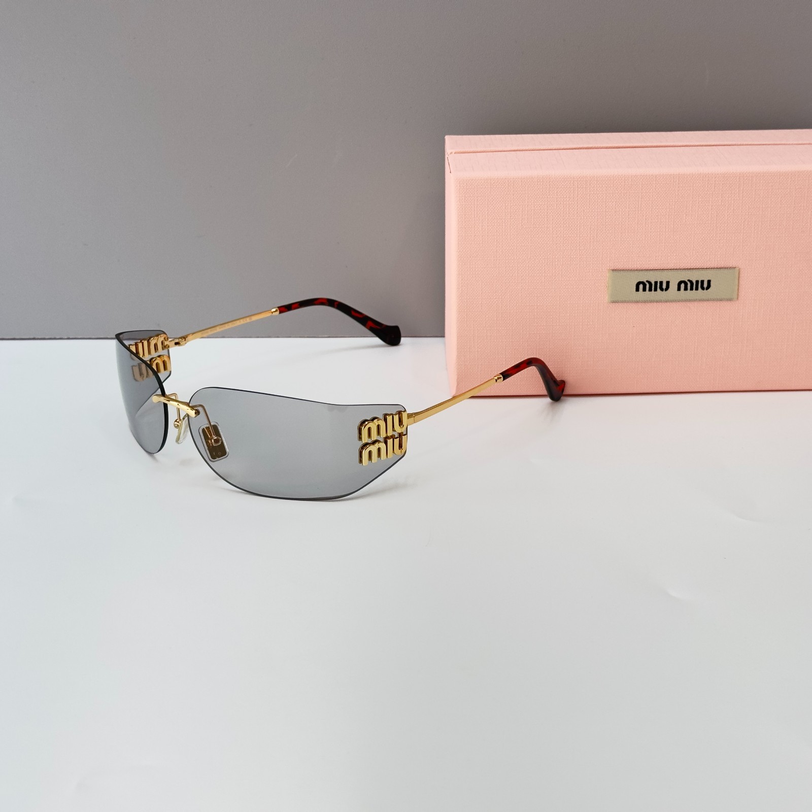 Miu Miu MU A51S Rimless Sunglasses Gold Frame Light Gray Lens Brand New With Box