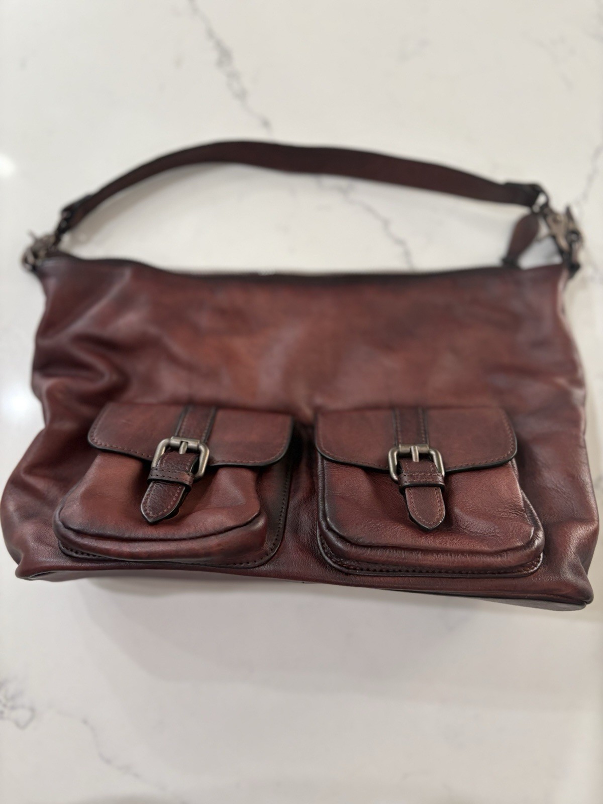 Elevate your style with this chic burgundy leather shoulder bag.