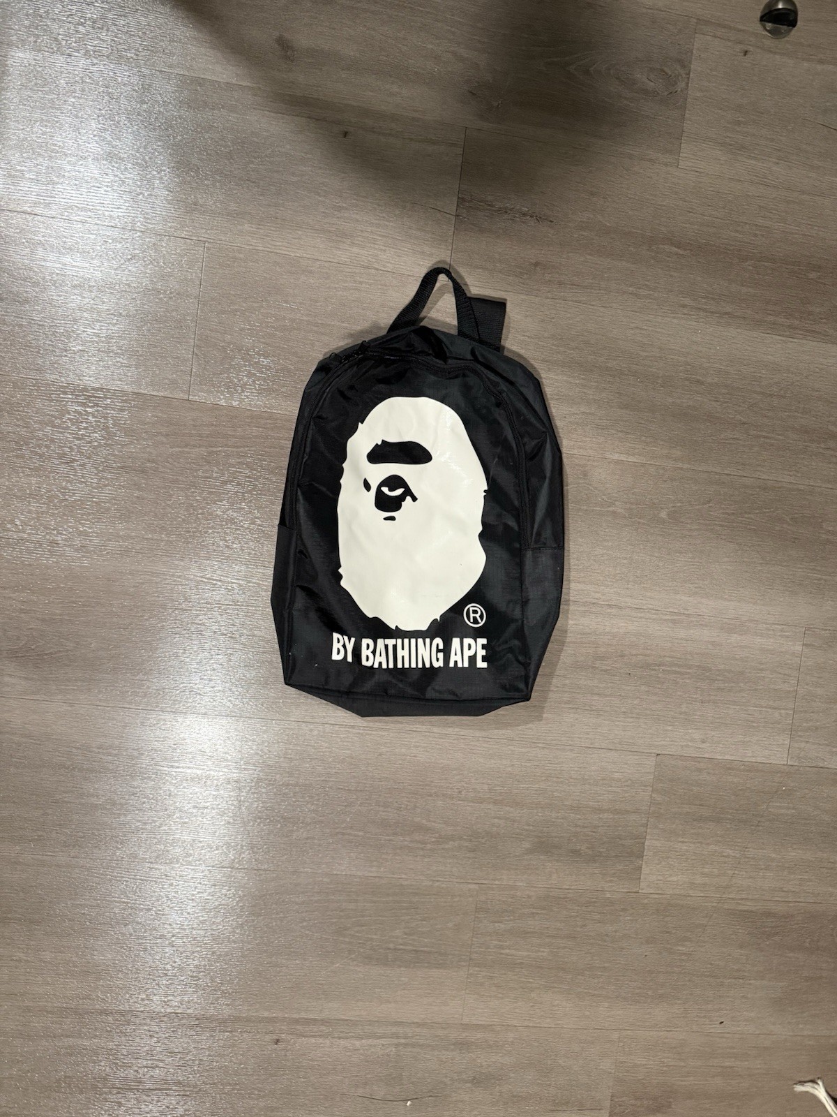BAPE A Bathing Ape Ape Head Mini Backpack Black White By Bathing Ape Logo