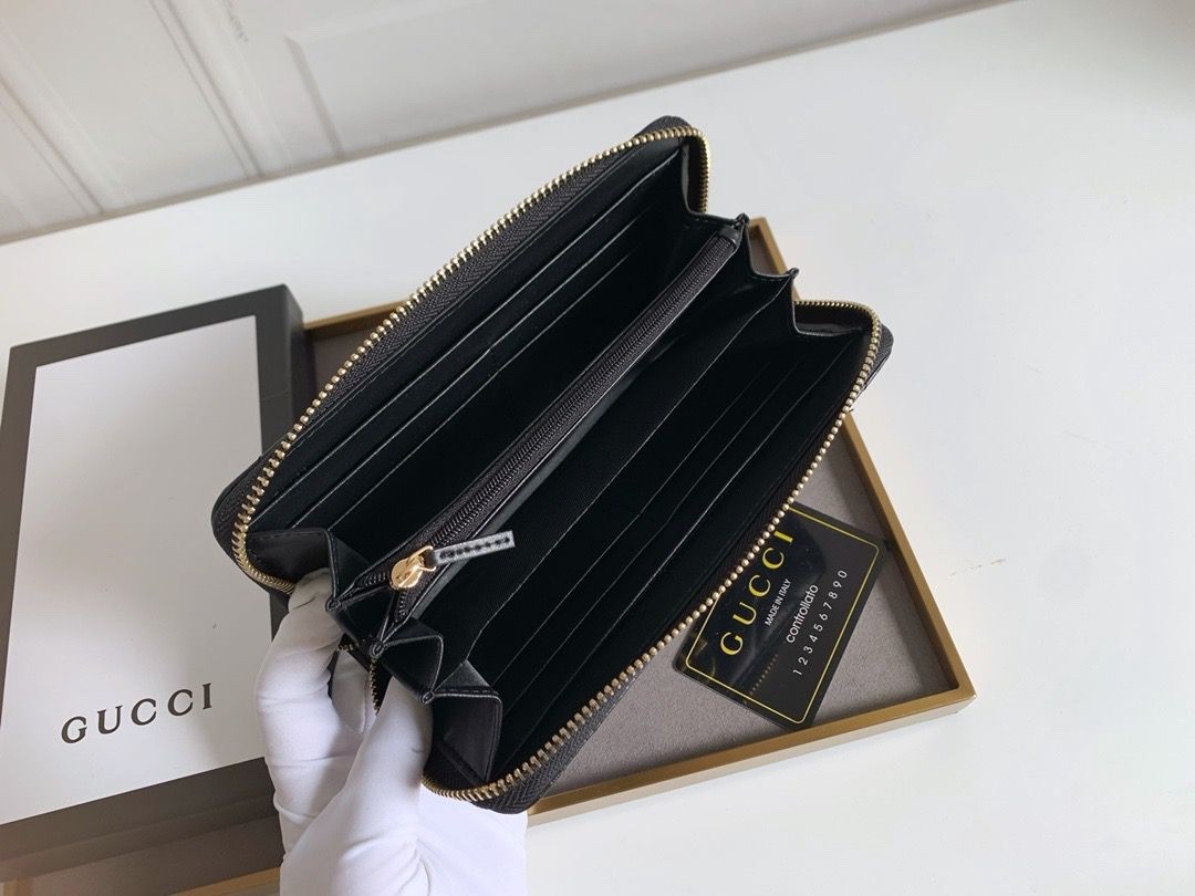 Gucci wallet black with gold GG zip around