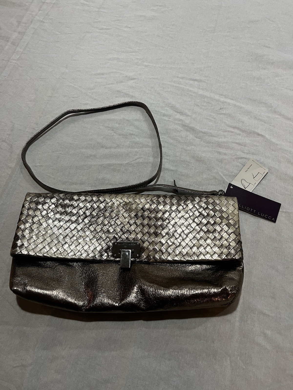 Elliott Lucca metallic woven leather convertible clutch/crossbody bag.