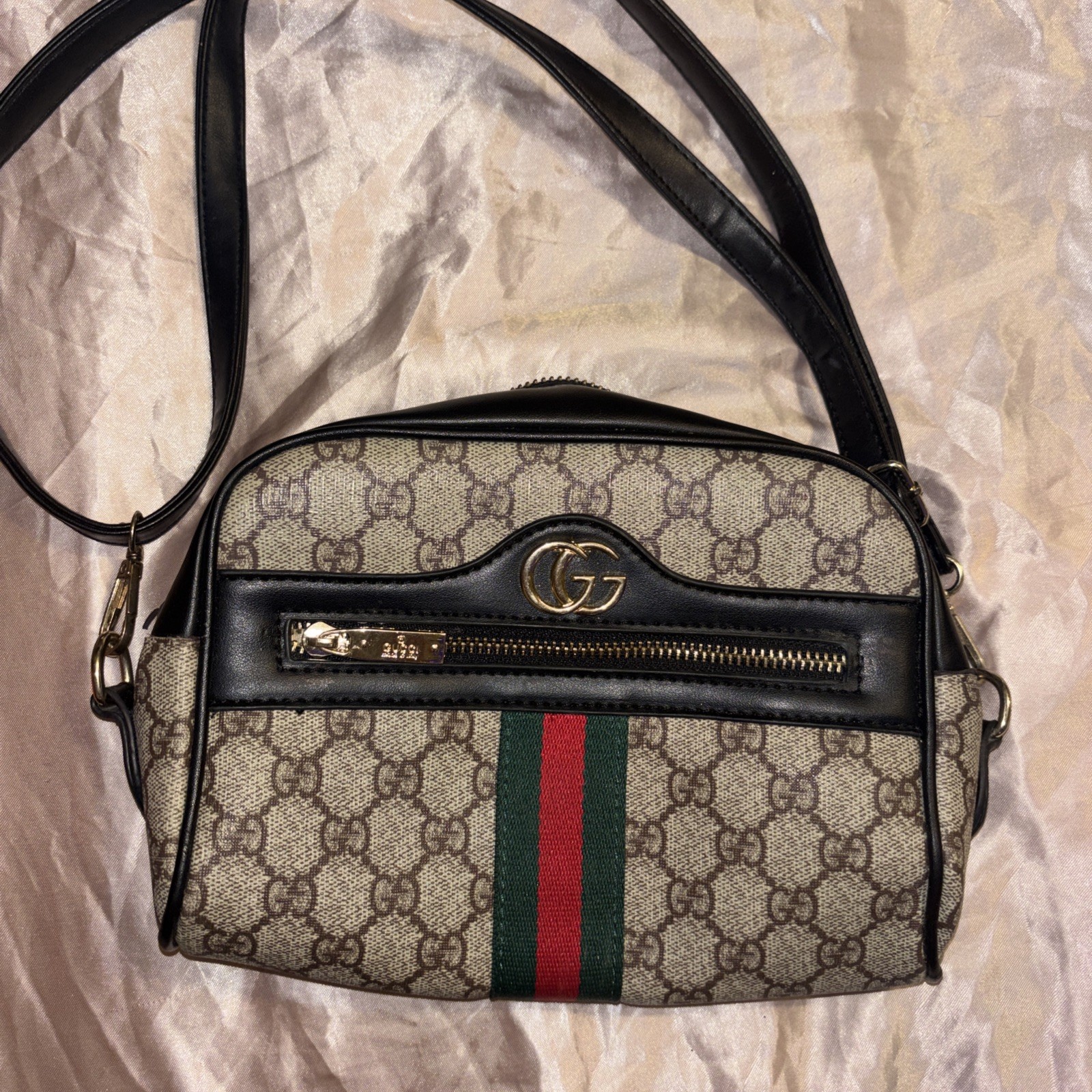 This is a Gucci GG Supreme Ophidia camera-style shoulder bag.