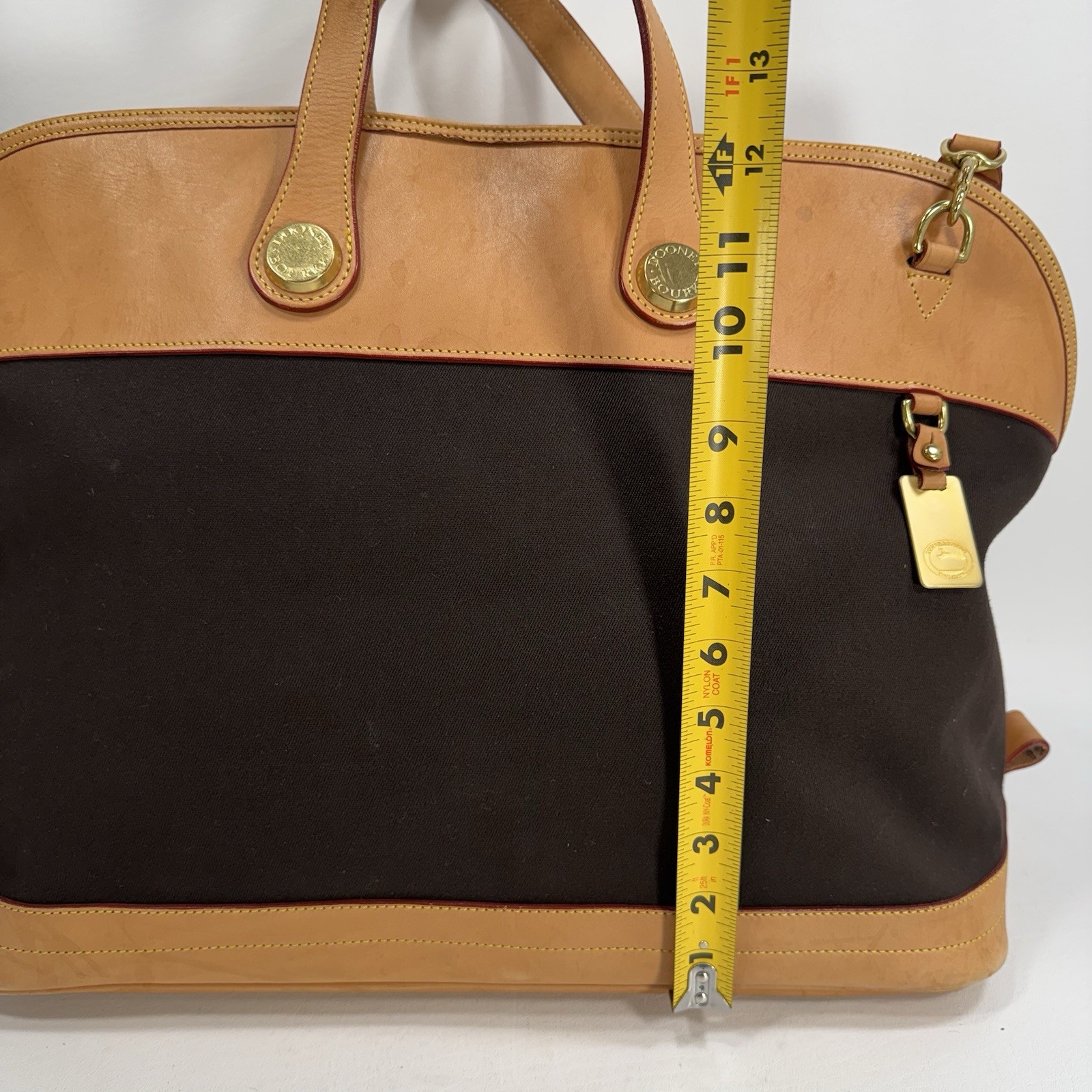 Dooney & Bourke Tan and Black Cabriolet Overnight Travel Bag – See Details