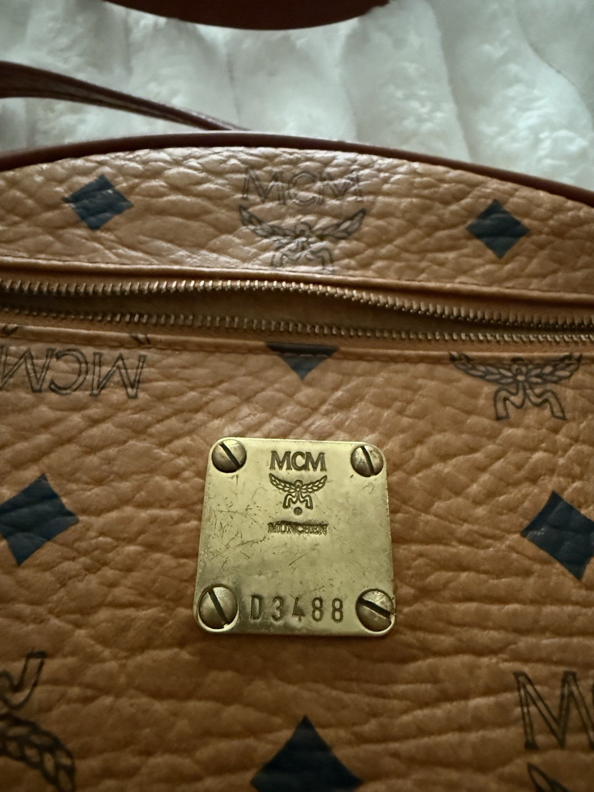 MCM Monogram Brown Oval Crossbody Bag Adjustable Strap Zip Closure Gold Hardware