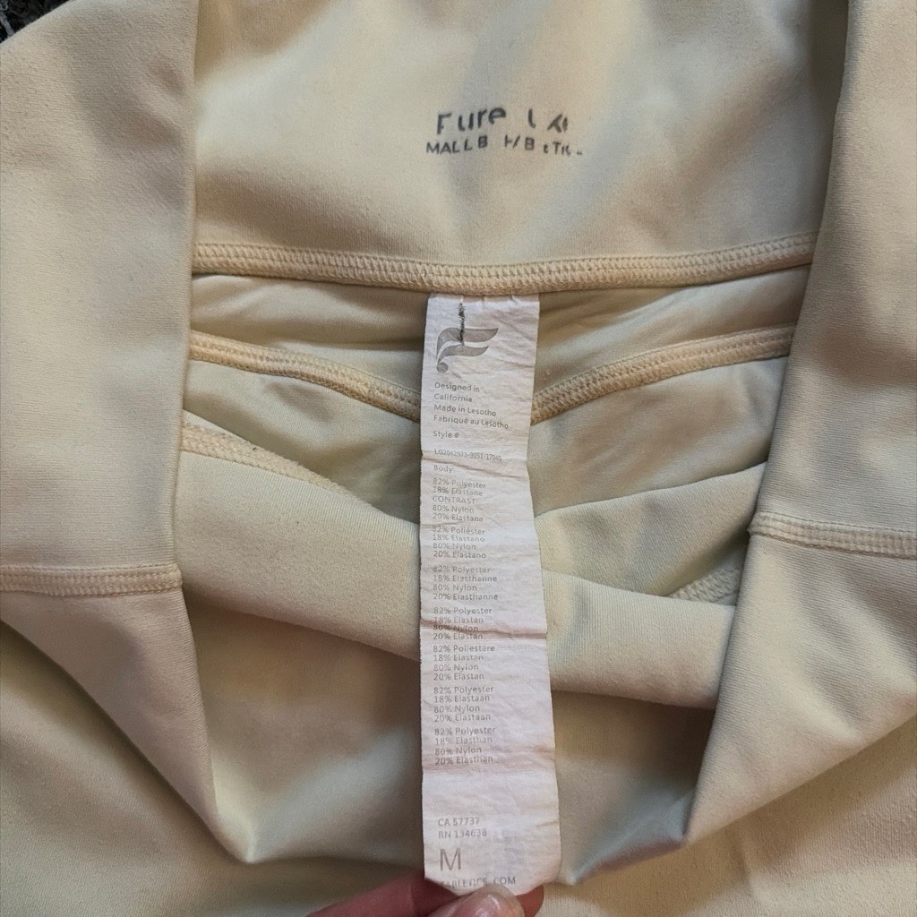 Light yellow Fabletics pureluxe leggings with pockets size Medium