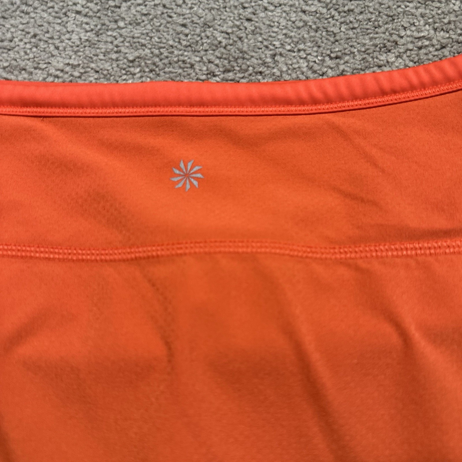 ATHLETA Action Skort in Dobby 14.5 Womens Small Orange Pockets Stretch Athletic
