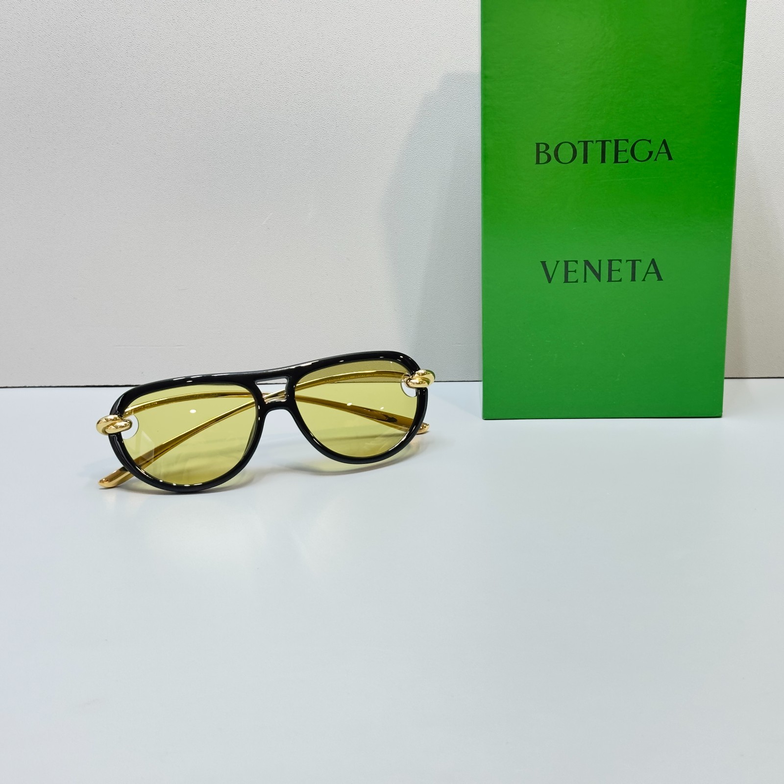 Bottega Veneta BV1418S Black Frame Yellow Lens Gold Knot Aviator Sunglasses