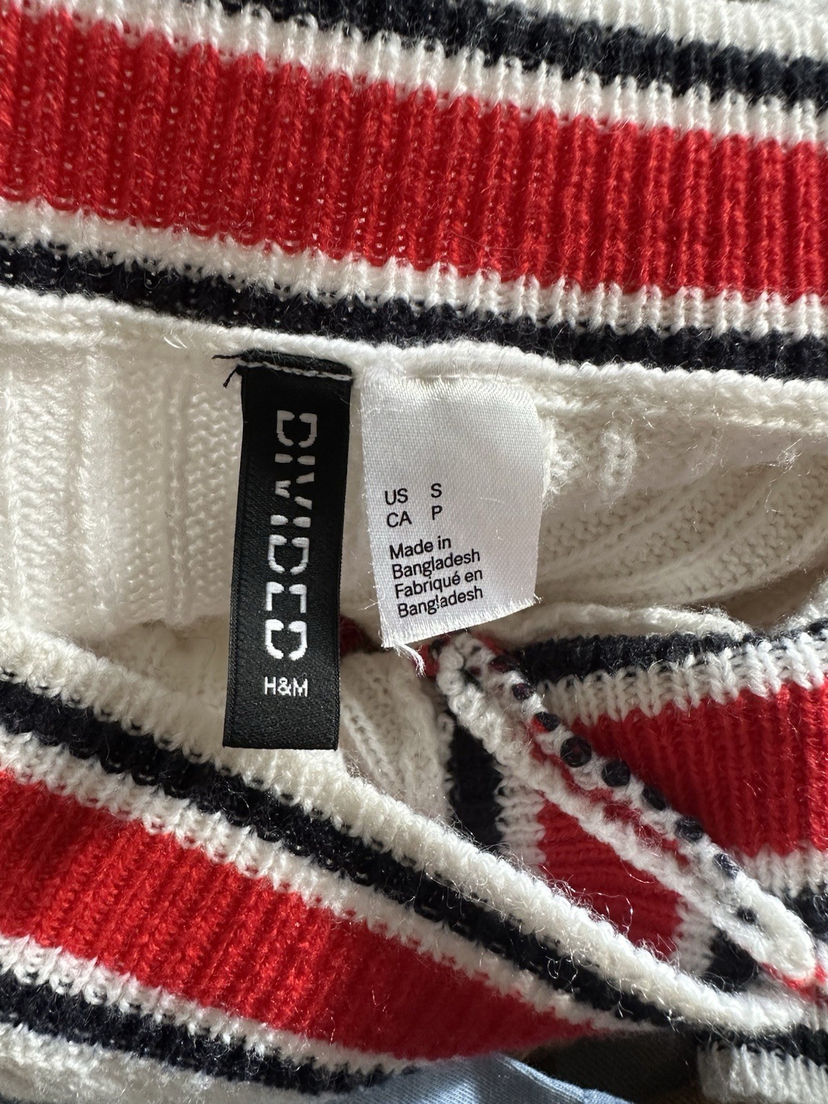 Divided – College prep v neck sweater. Red and black stripe on white. Small