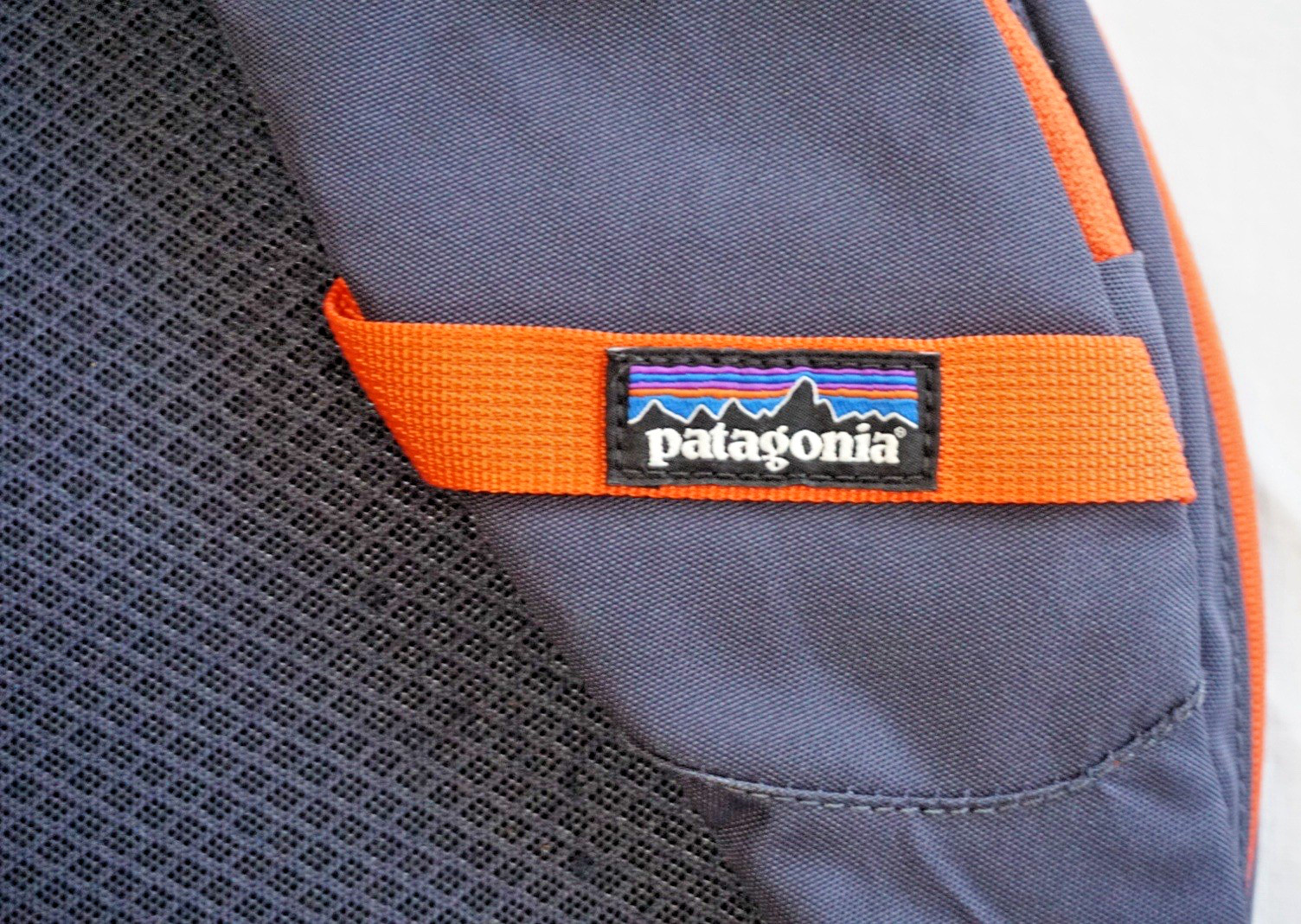 Patagonia Atom Sling 8L Backpack Crossbody Daypack Navy Orange Hiking Travel