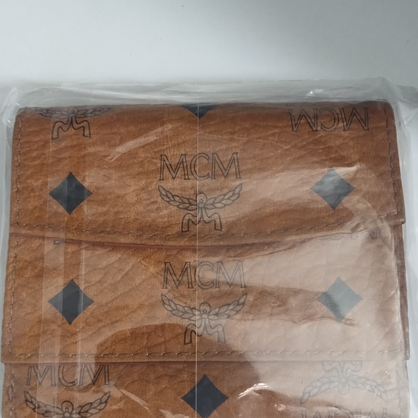 MCM Brown Logo Print Folding Wallet for Unisex with MCM Character Logo Theme