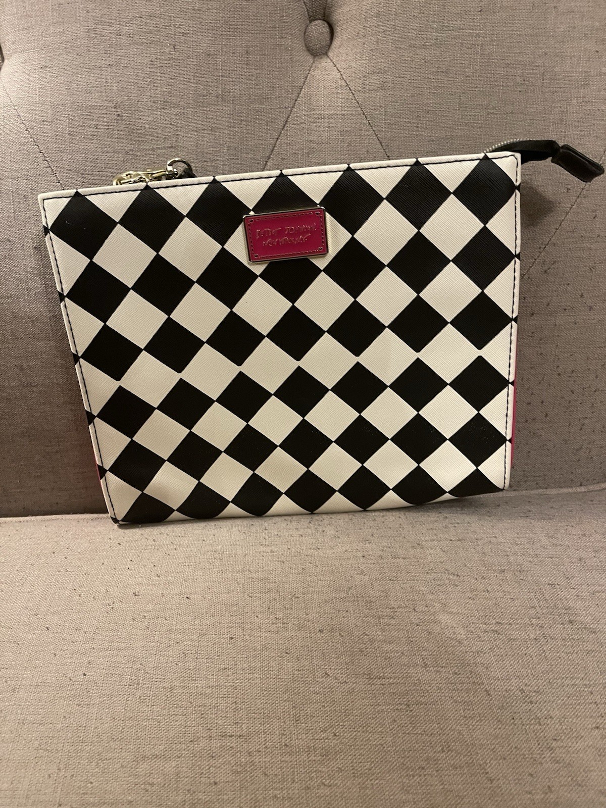 Betsey Johnson wristlet black and white checkerboard print and a pink logo