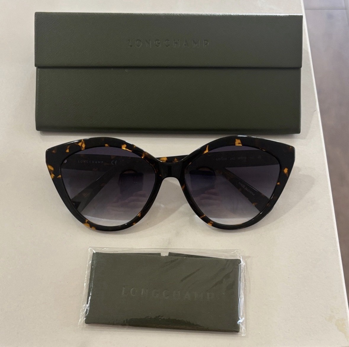 Longchamp Tortoiseshell Cat-Eye Sunglasses with Gradient Black Lenses.
