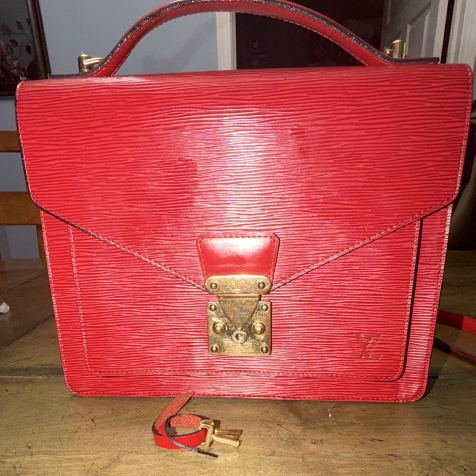 Louis Vuitton Red Epi Monceau 28 Handbag in textured leather/gold-tone hardware
