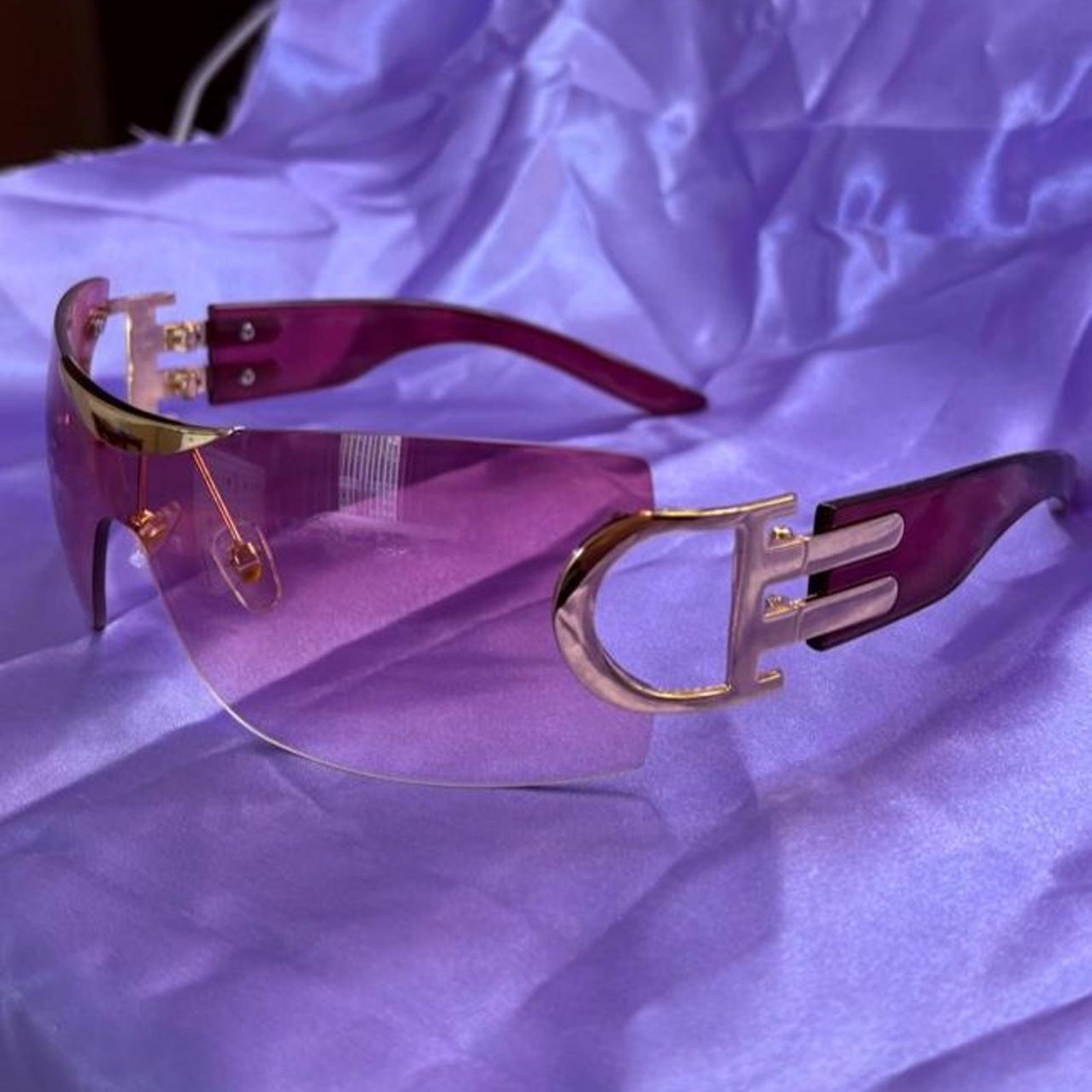 Y2K shield sunglasses with pink gradient lenses and gold-tone logo hardware
