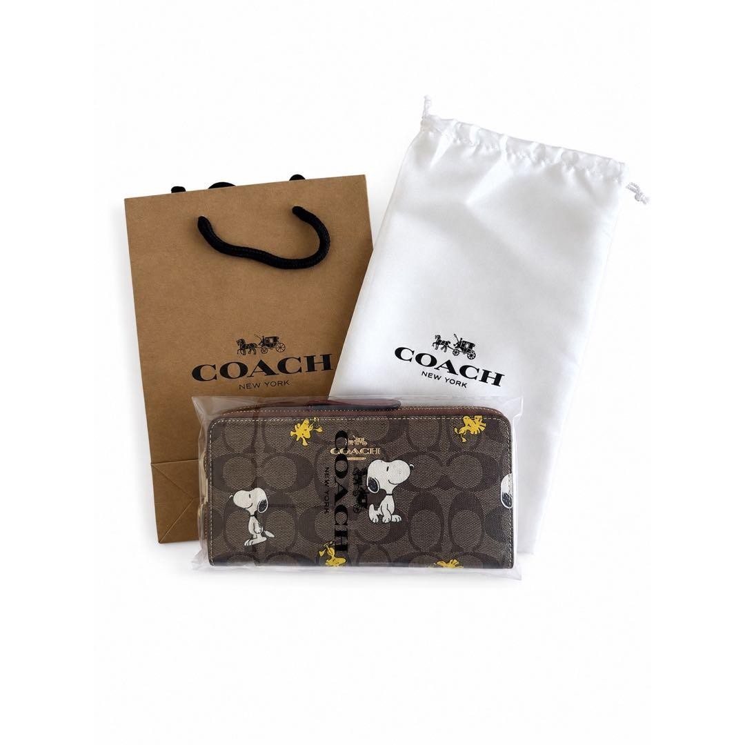 Brand New and Unopened COACH Snoopy Long Wallet Signature Pattern
