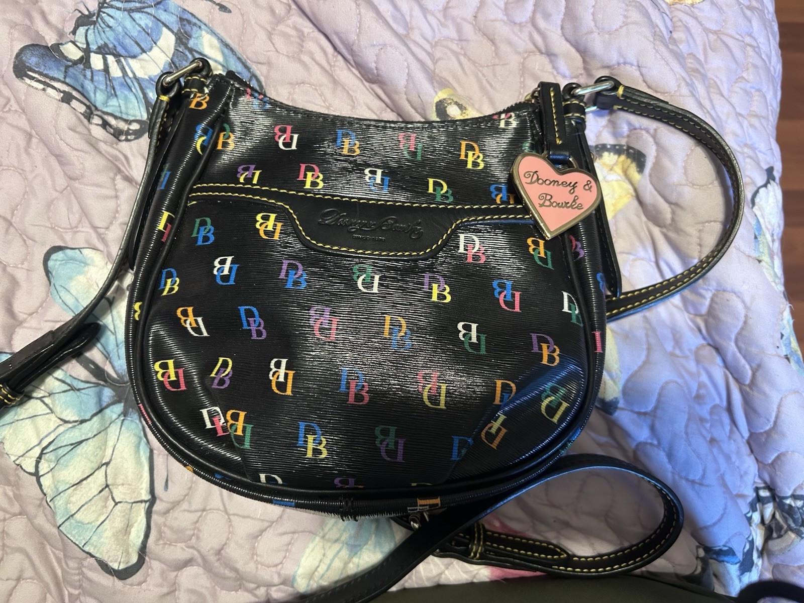 This Dooney & Bourke DB75 Multi rainbow logo crossbody bag