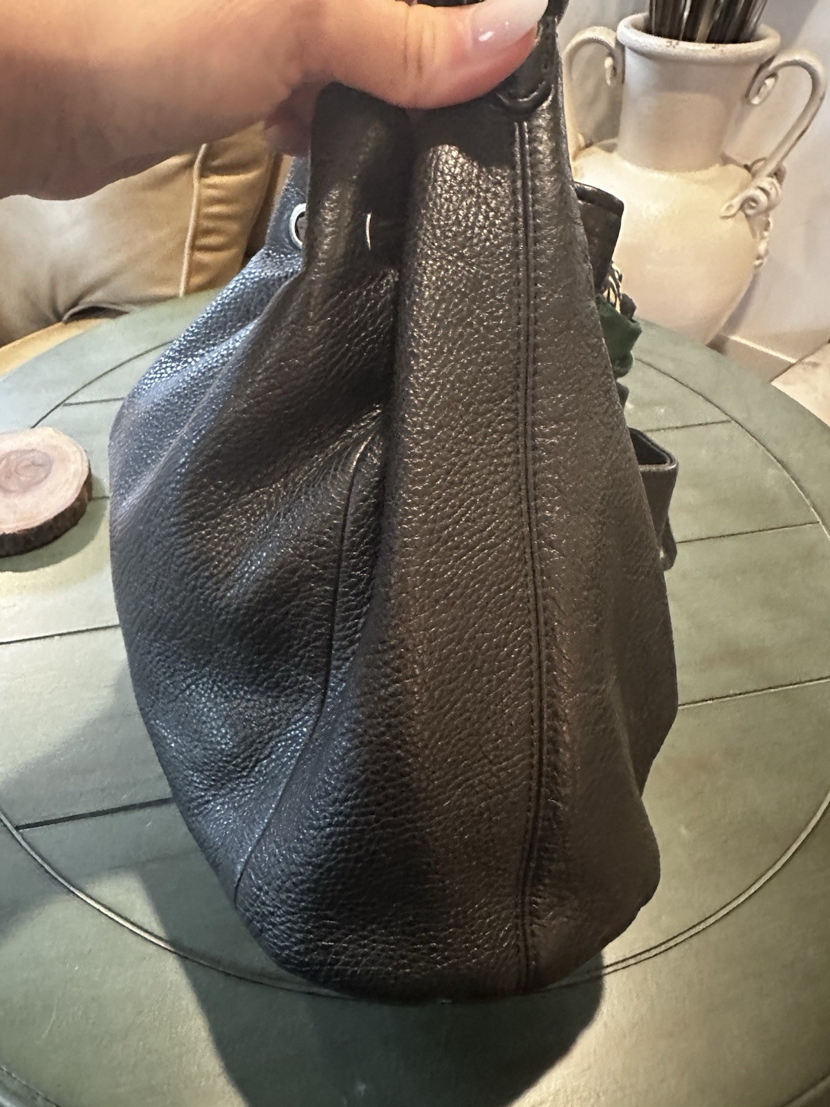 Coach Avery bucket bag. Drawstring closure and silver-tone hardware.