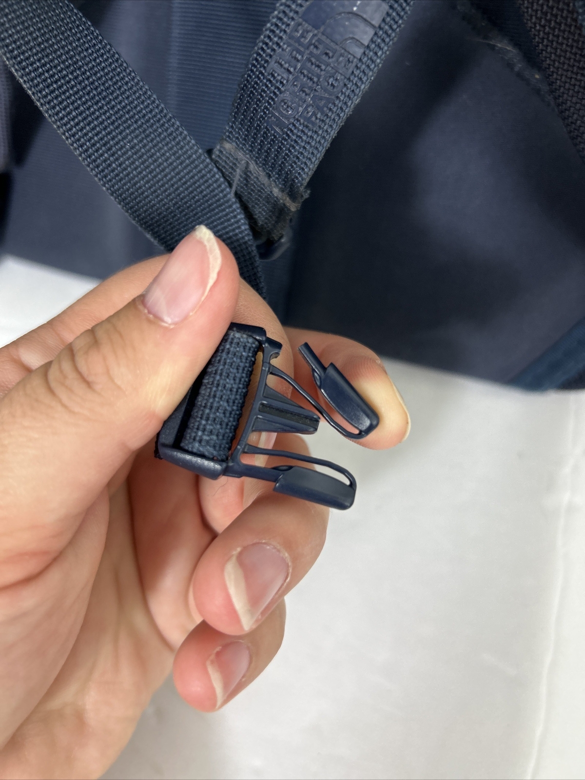 The North Face Lineage 20L backpack book bag navy used Flaw Small Rip On Side