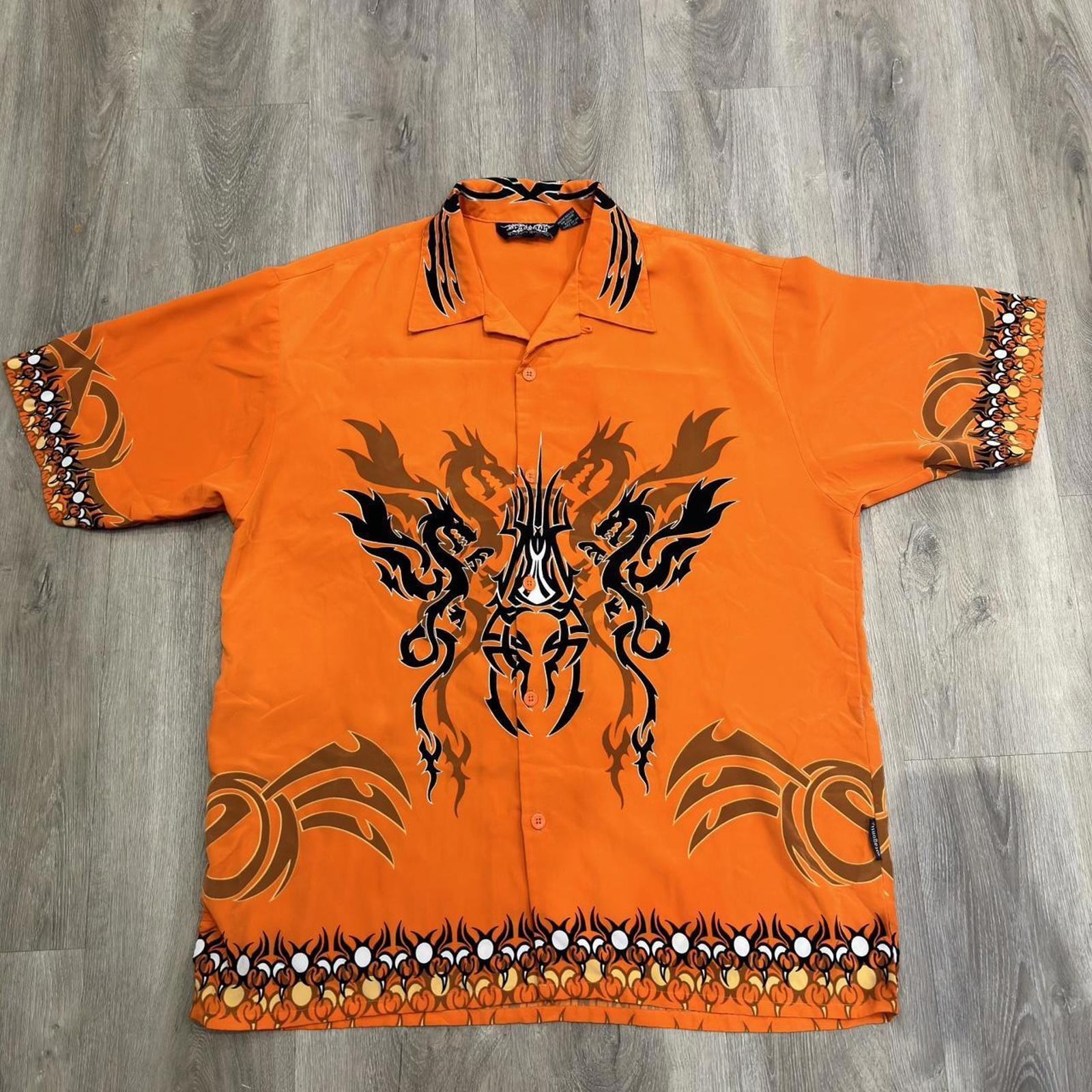 Orange and black dragon button up shirt with a small hole can be sewed size xl