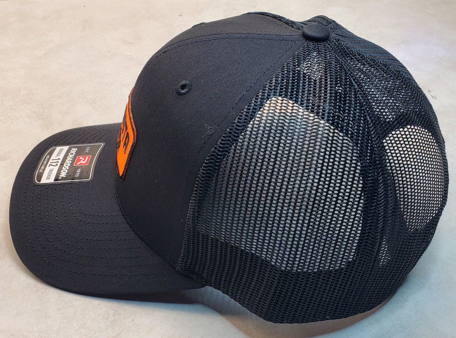 Kubota Tractor Emb. Patch on Richardson 112 Trucker Hat Snapback Black/Black